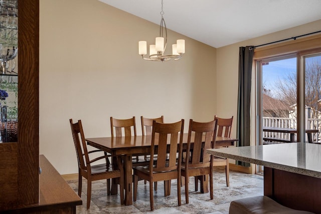 dining room with an inviting chandelier and lofted ceiling