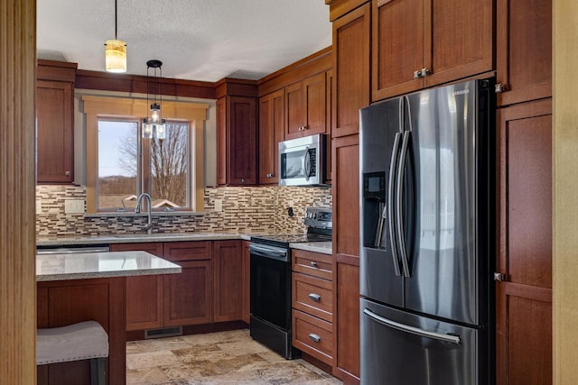 kitchen with tasteful backsplash, brown cabinetry, visible vents, and stainless steel appliances