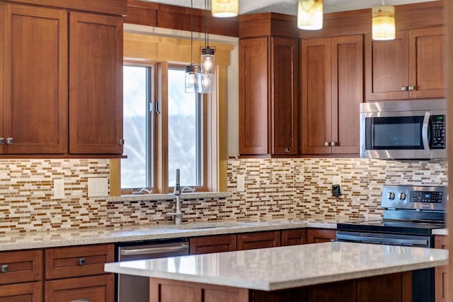 kitchen with tasteful backsplash, plenty of natural light, and appliances with stainless steel finishes