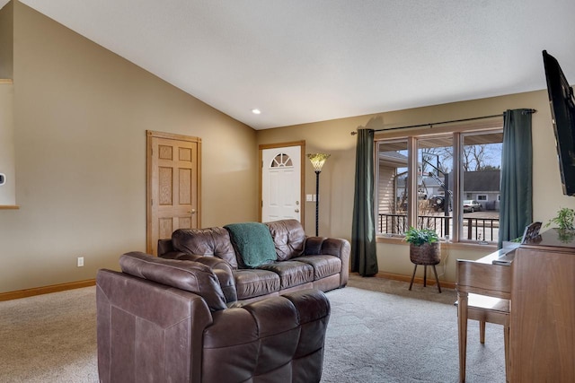 living area with vaulted ceiling, carpet flooring, and baseboards