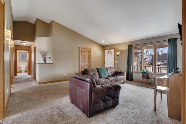 living area with carpet flooring, baseboards, and high vaulted ceiling