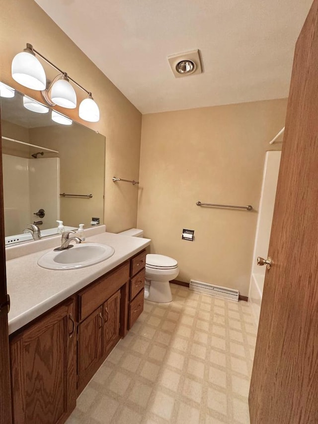 full bathroom with vanity, baseboards, bathtub / shower combination, tile patterned floors, and toilet