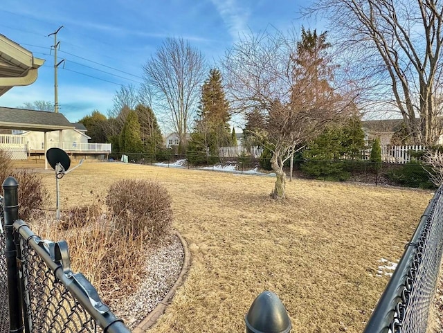 view of yard with a water view and fence