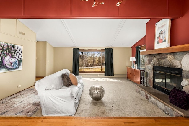 living room with vaulted ceiling, a fireplace, and visible vents