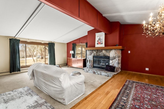 living room featuring a baseboard heating unit, plenty of natural light, a fireplace, and vaulted ceiling with beams