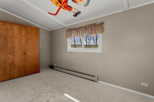 unfurnished bedroom featuring baseboards, carpet floors, baseboard heating, and vaulted ceiling