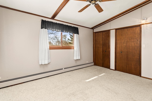 unfurnished bedroom with a baseboard heating unit, lofted ceiling, ornamental molding, and multiple closets