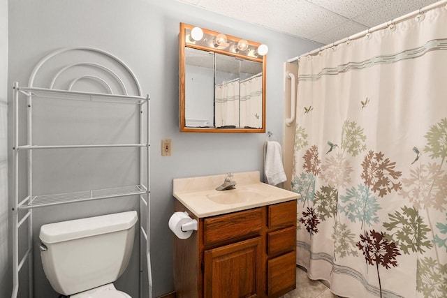 bathroom featuring vanity, a shower with shower curtain, toilet, and tile patterned floors