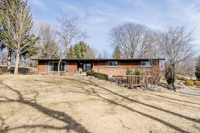 ranch-style house featuring a chimney