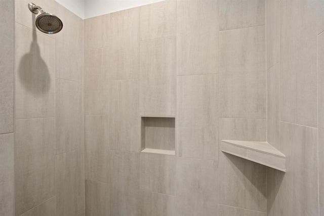 details with a tile shower