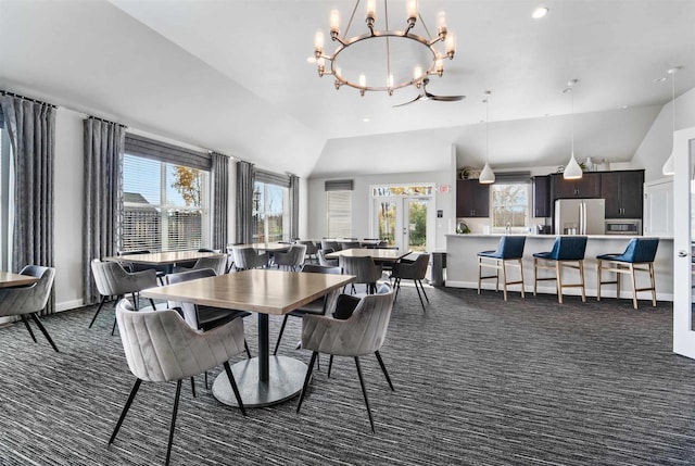 dining space featuring baseboards, an inviting chandelier, recessed lighting, vaulted ceiling, and dark colored carpet