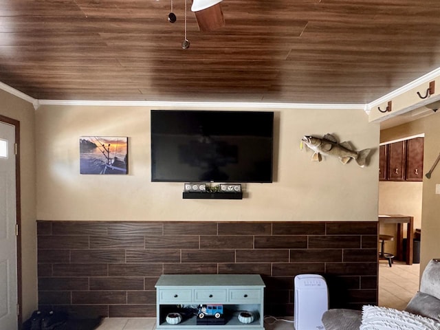 cinema featuring a wainscoted wall, wooden ceiling, and crown molding