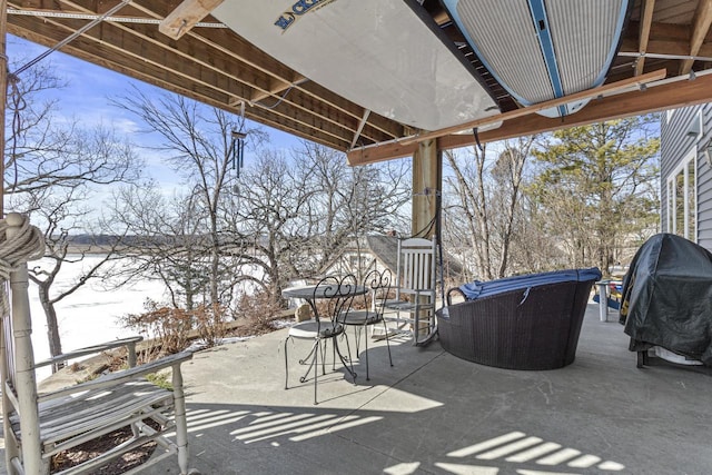 view of patio / terrace with a water view