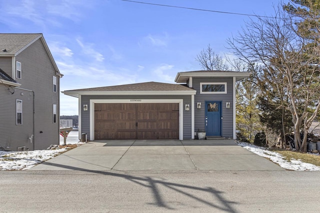 prairie-style house with a garage and driveway