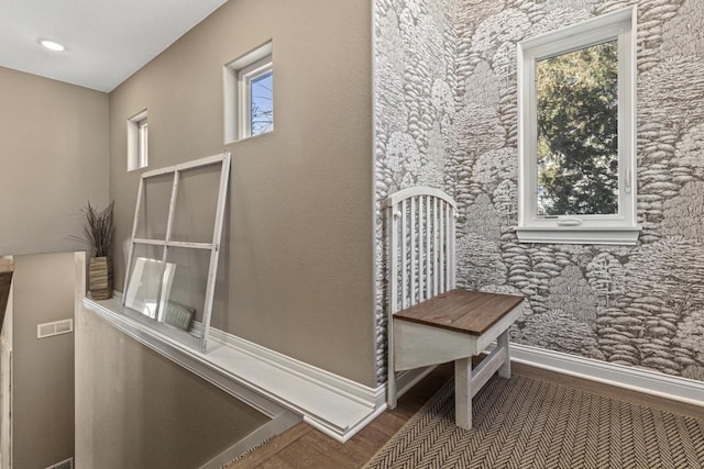 room details featuring recessed lighting, wood finished floors, visible vents, and baseboards