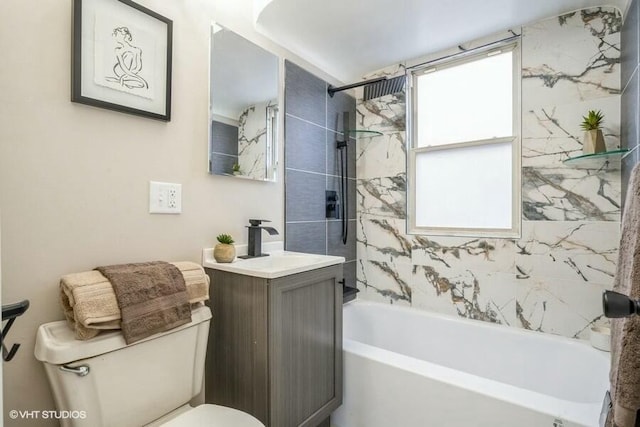 bathroom with vanity, toilet, and shower / bathtub combination