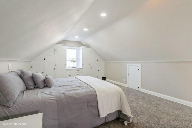 carpeted bedroom with vaulted ceiling, recessed lighting, and baseboards