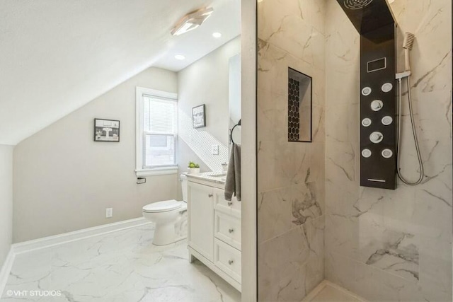 bathroom with toilet, marble finish floor, baseboards, vanity, and vaulted ceiling