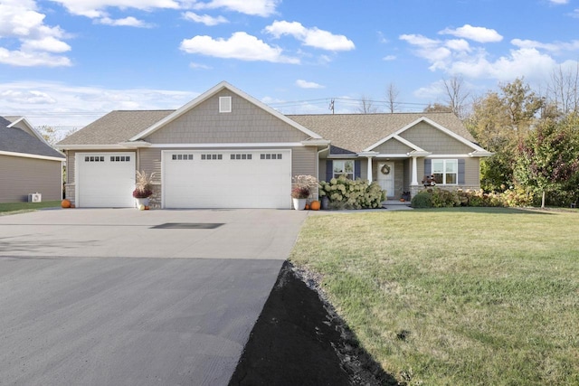 view of front of property featuring a garage, concrete driveway, and a front yard