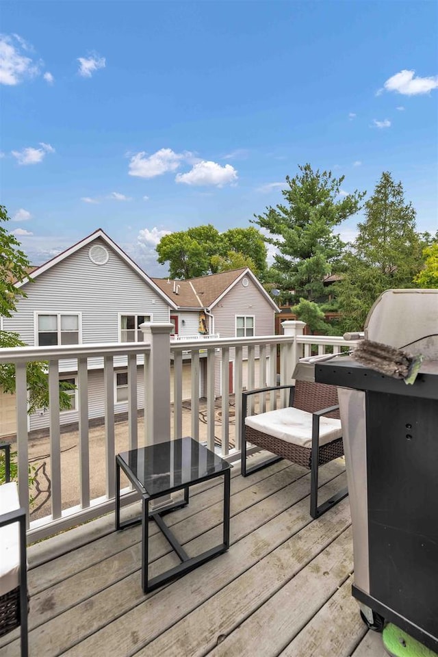 wooden terrace with area for grilling