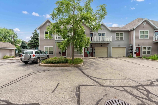 view of property with an attached garage and driveway