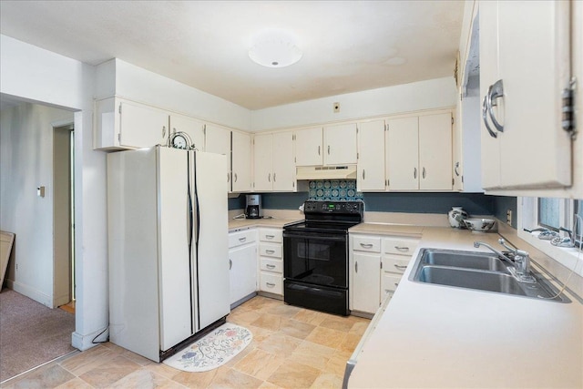 kitchen with black range with electric stovetop, under cabinet range hood, light countertops, freestanding refrigerator, and a sink