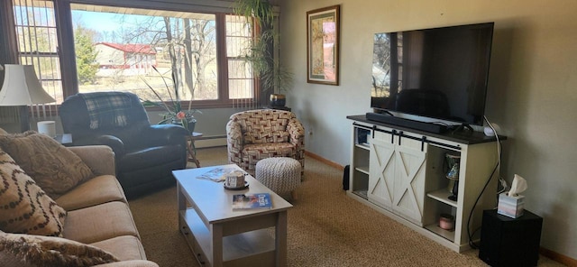 living area featuring a baseboard radiator, baseboards, and carpet floors