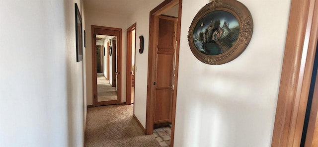 hallway with light colored carpet