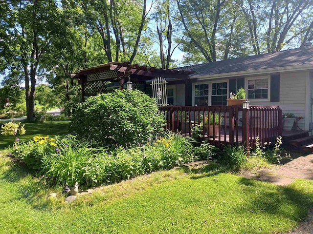 view of yard with a deck and a pergola