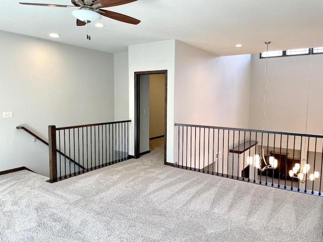 carpeted spare room with recessed lighting, baseboards, and ceiling fan