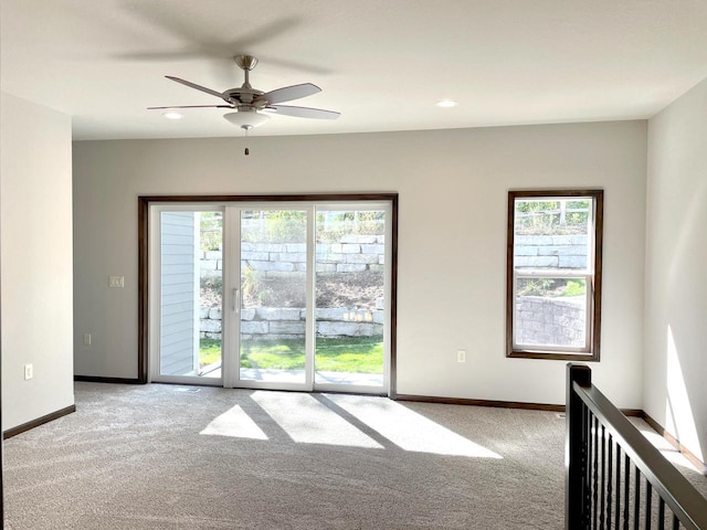 spare room featuring recessed lighting, baseboards, ceiling fan, and carpet flooring