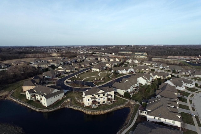 birds eye view of property featuring a residential view and a water view