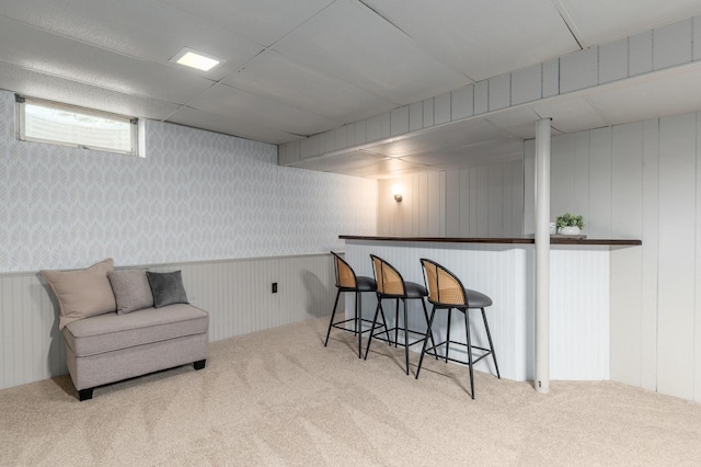 kitchen with carpet and a breakfast bar