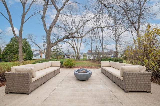 view of patio featuring an outdoor living space with a fire pit