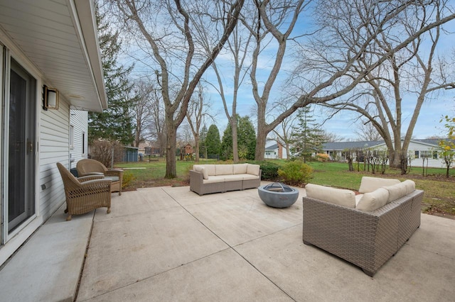 view of patio / terrace featuring an outdoor living space with a fire pit