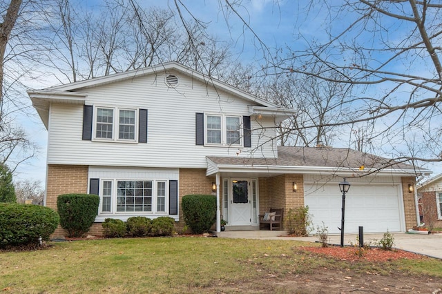 view of front facade with brick siding, an attached garage, concrete driveway, and a front yard