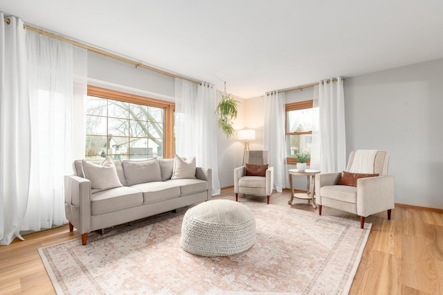 living area with wood finished floors and baseboards