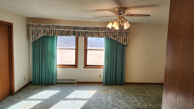 empty room with a baseboard heating unit, a textured ceiling, ceiling fan, and carpet flooring