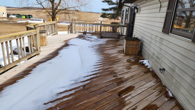 view of snow covered deck