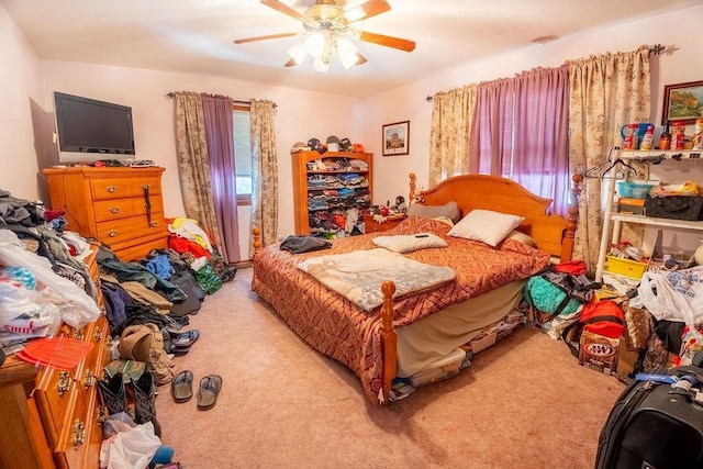 bedroom with multiple windows, carpet flooring, and ceiling fan