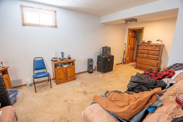 living area with a textured ceiling, baseboards, and light carpet