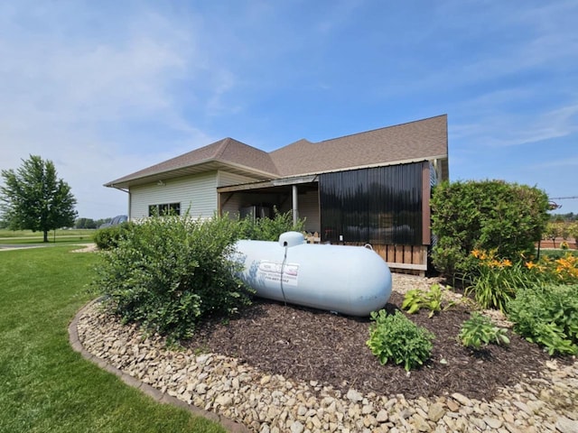 view of property exterior featuring a yard