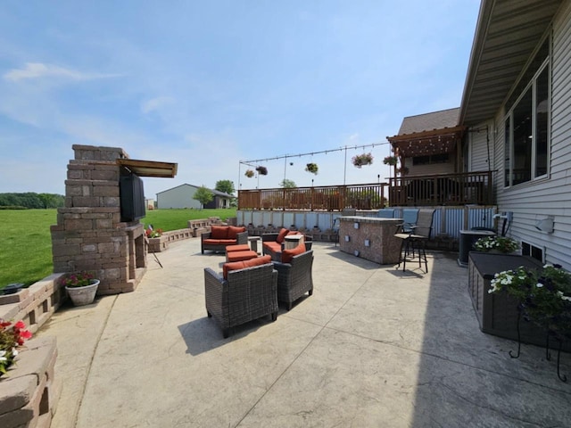 view of patio with outdoor dry bar and outdoor lounge area