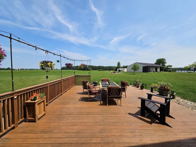 wooden terrace featuring a yard