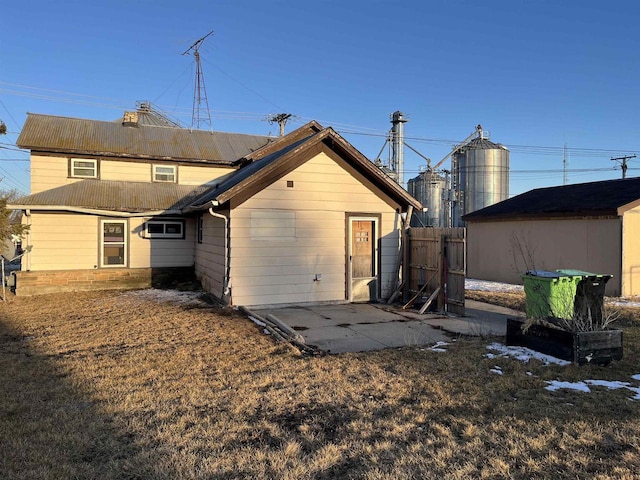 back of house featuring a patio and fence