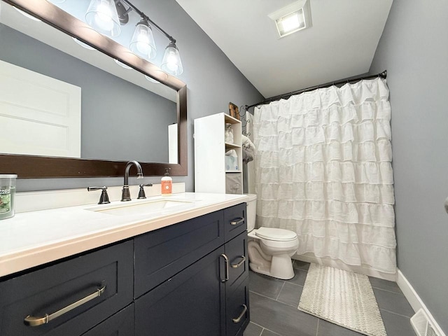 bathroom featuring tile patterned floors, visible vents, toilet, and vanity