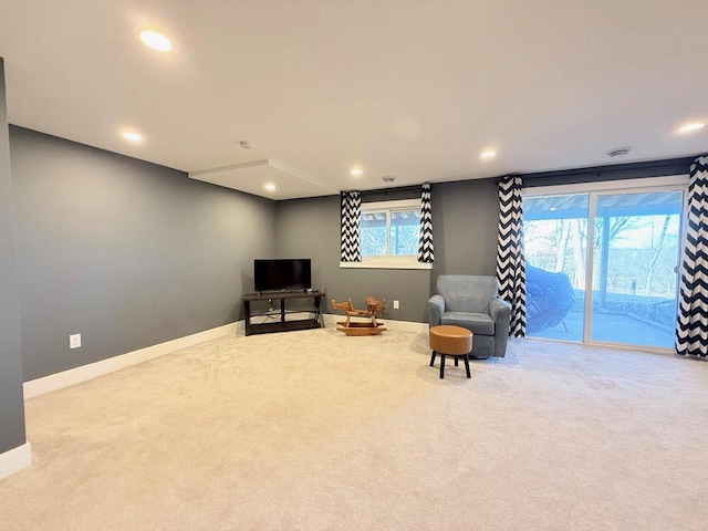 living area featuring carpet flooring, recessed lighting, and baseboards