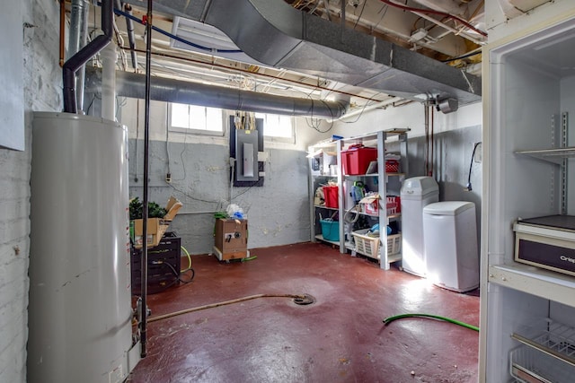 basement featuring water heater and electric panel