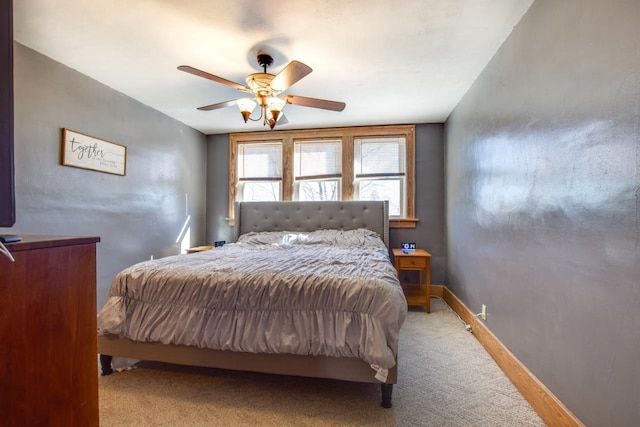 bedroom with baseboards, carpet floors, and ceiling fan