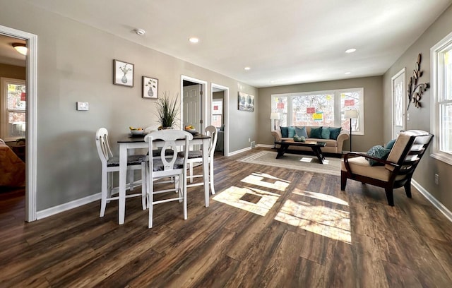 dining space featuring dark wood-type flooring, recessed lighting, and baseboards